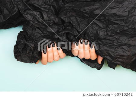 Black manicure with crumpled paper Black manicure with crumpled paper 60710241
