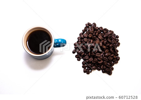 Blue cup of coffee by a pile of coffee beans 60712528