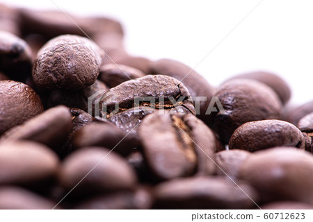 Close up of coffee beans on a white background 60712623