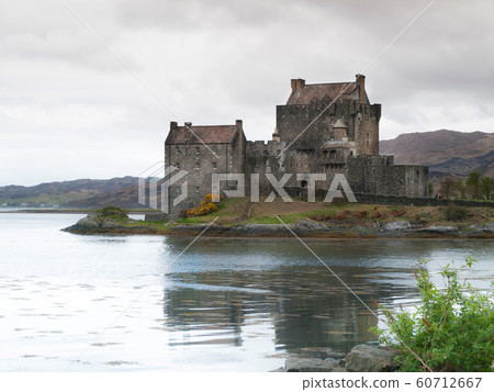 Eilean Donan castle mirroring in water of Loch Eilean Donan castle mirroring in water of Loch 60712667