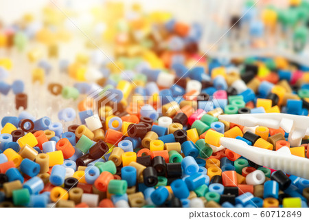 Set of perler beads with tweezers on child table Set of perler beads with tweezers on child table 60712849