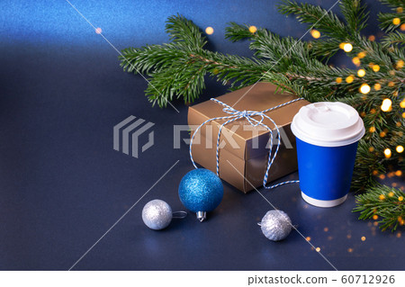 Blank blue takeaway coffee cup with Christmas decorations 60712926