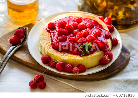 Cheesecake with raspberry sauce Cheesecake with raspberry sauce 60712936