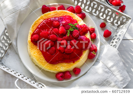 Cheesecake with raspberry sauce Cheesecake with raspberry sauce 60712939