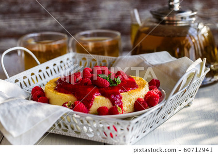 Cheesecake with raspberry sauce 60712941