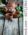 Tea and spring blossom background 60712964