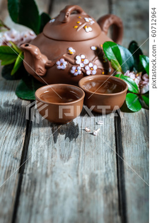 Tea and spring blossom background Tea and spring blossom background 60712964
