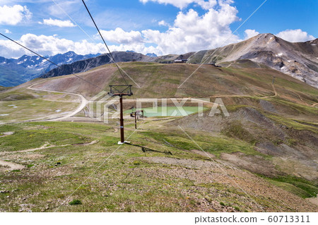 Mountains of Livigno Alps on the border between Italy and Switzerland, view from Lac Salin cable car station, sunny summer day, Italy Mountains of Livigno Alps on the border between Italy and Switzerland, view from Lac Salin cable car station, sunny summer day, Italy 60713311