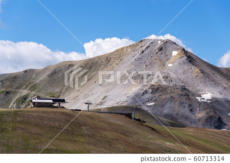 Mountains of Livigno Alps on the border between Italy and Switzerland, view from Lac Salin cable car station, sunny summer day, Italy Mountains of Livigno Alps on the border between Italy and Switzerland, view from Lac Salin cable car station, sunny summer day, Italy 60713314