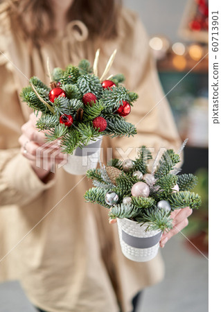 Two Beautiful festive arrangements of fresh spruce in coffee Cup. Christmas mood. Two Beautiful festive arrangements of fresh spruce in coffee Cup. Christmas mood. 60713901