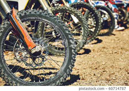 Motocross. Motorcycles getting ready for the start of the side view 60714787