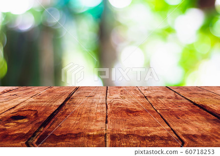 Empty wooden table with blurred on nature bokeh background Empty wooden table with blurred on nature bokeh background 60718253