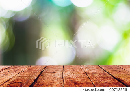 Empty wooden table with blurred on nature bokeh background Empty wooden table with blurred on nature bokeh background 60718256