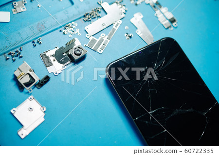 Cracked modern smartphone 60722335