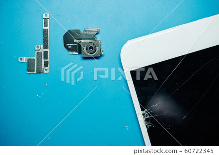 Cracked smartphone with broken details Cracked smartphone with broken details 60722345