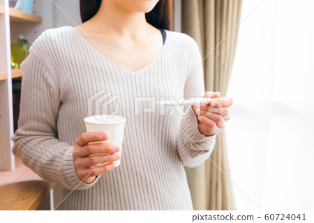 Woman examining ovulation day with test medicine 60724041