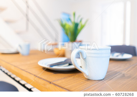 Newly built house tableware on a wooden table Newly built house tableware on a wooden table 60728268