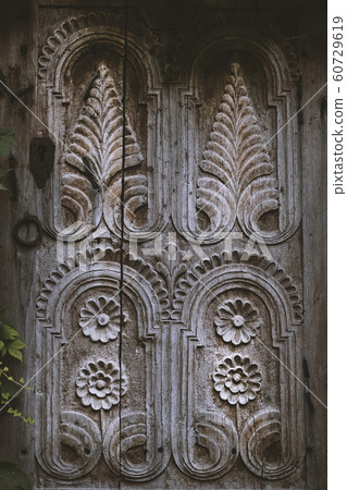 Wooden window platband with beautiful ornament 60729619