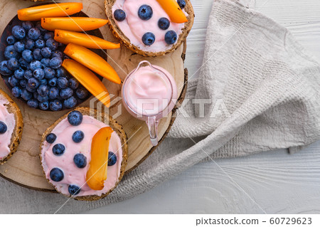 Closeup view of sweet buns with yogurt 60729623