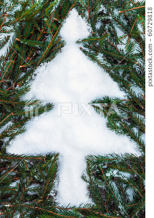 figure of a Christmas tree laid out of spruce twigs figure of a Christmas tree laid out of spruce twigs 60729818