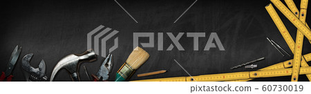 Hand tools on a blackboard with copy space - Home improvement concept Hand tools on a blackboard with copy space - Home improvement concept 60730019