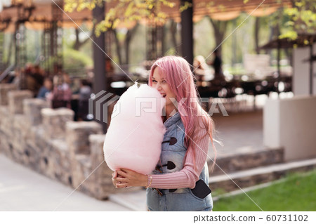 Portrait of a lovely pink-haired girl outdoors 60731102