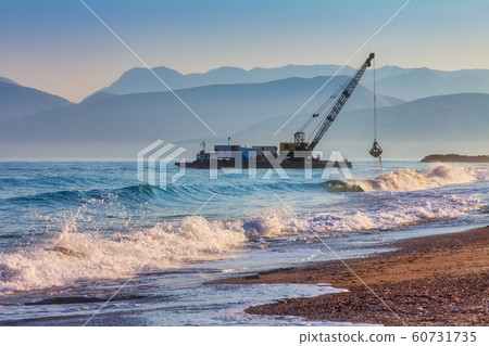 Sea digger adjusting coast. Sea digger adjusting coast. 60731735
