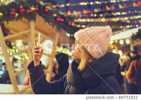 Stylish girl at the christmas market Stylish girl at the christmas market 60731932