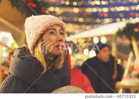 Stylish girl at the christmas market 60731933