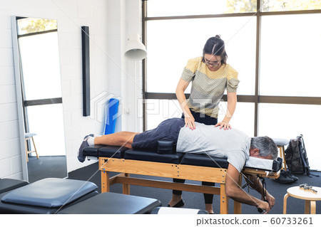 Senior man having chiropractic adjustment. 60733261