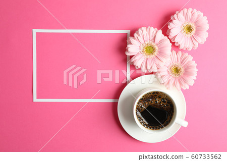 Beautiful pink gerbera flowers, cup of coffee and Beautiful pink gerbera flowers, cup of coffee and 60733562