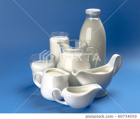 Collection of dairy products on blue wooden background Collection of dairy products on blue wooden background 60734050