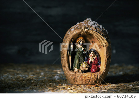 the holy family in a rustic nativity scene 60734109