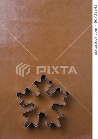Raw dough for gingerbread cookie and cutter Raw dough for gingerbread cookie and cutter 60735843