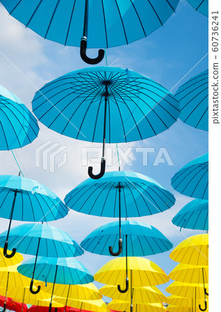 Outdoor art design and decor. Umbrellas float in 60736241