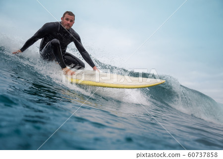 surfer riding waves on the island of fuerteventura surfer riding waves on the island of fuerteventura 60737858