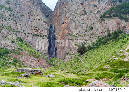 Summer landscape with mountain waterfall between two rocks Summer landscape with mountain waterfall between two rocks 60737941