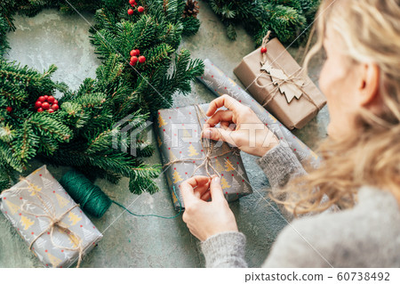 woman packs a gift 60738492