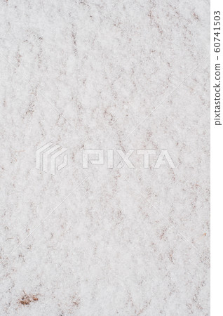 Fluffy snow covered frozen ground with thin layer. 60741503