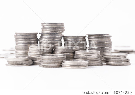A group of silver coin shallow focus on white A group of silver coin shallow focus on white 60744230