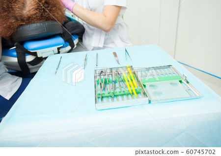 Tools for the periodontist.Scalers in stomatology.Multi-colored dental curettes. Curettes for dental fillings. Dental probes.Bilateral stomatologic probes. Dentistry. 60745702