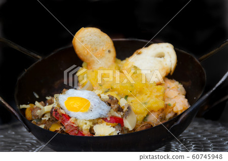 Argentine Creole steak cooked on the plow disk Argentine Creole steak cooked on the plow disk 60745948