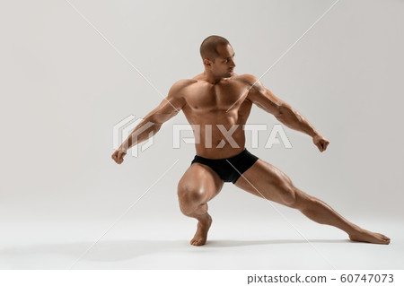 Athletic man training full-length shot 60747073