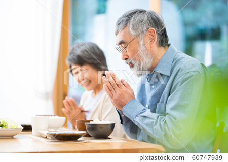 Senior couple eating meal meal breakfast lunch dinner Senior couple eating meal meal breakfast lunch dinner 60747989
