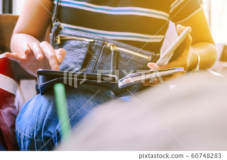 Woman Using a Smart Phone Woman Using a Smart Phone 60748283