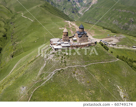 Aerial view to Gergeti Trinity Church or Tsminda in Georgia Aerial view to Gergeti Trinity Church or Tsminda in Georgia 60749174