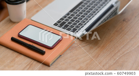 Cropped shot of  workplace with smartphone, laptop 60749903