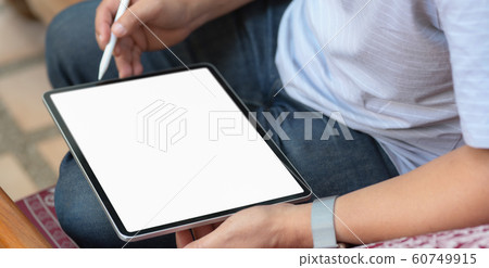 Cropped shot of businessman using blank screen 60749915
