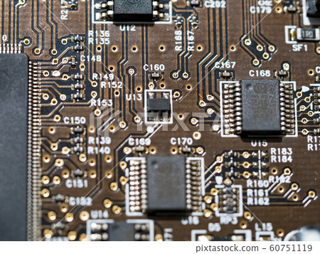 Closeup of computer micro circuit board with integrated chipset 60751119