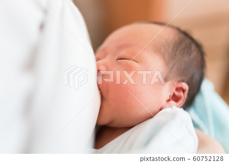 Newborn sucking breast milk Newborn sucking breast milk 60752128